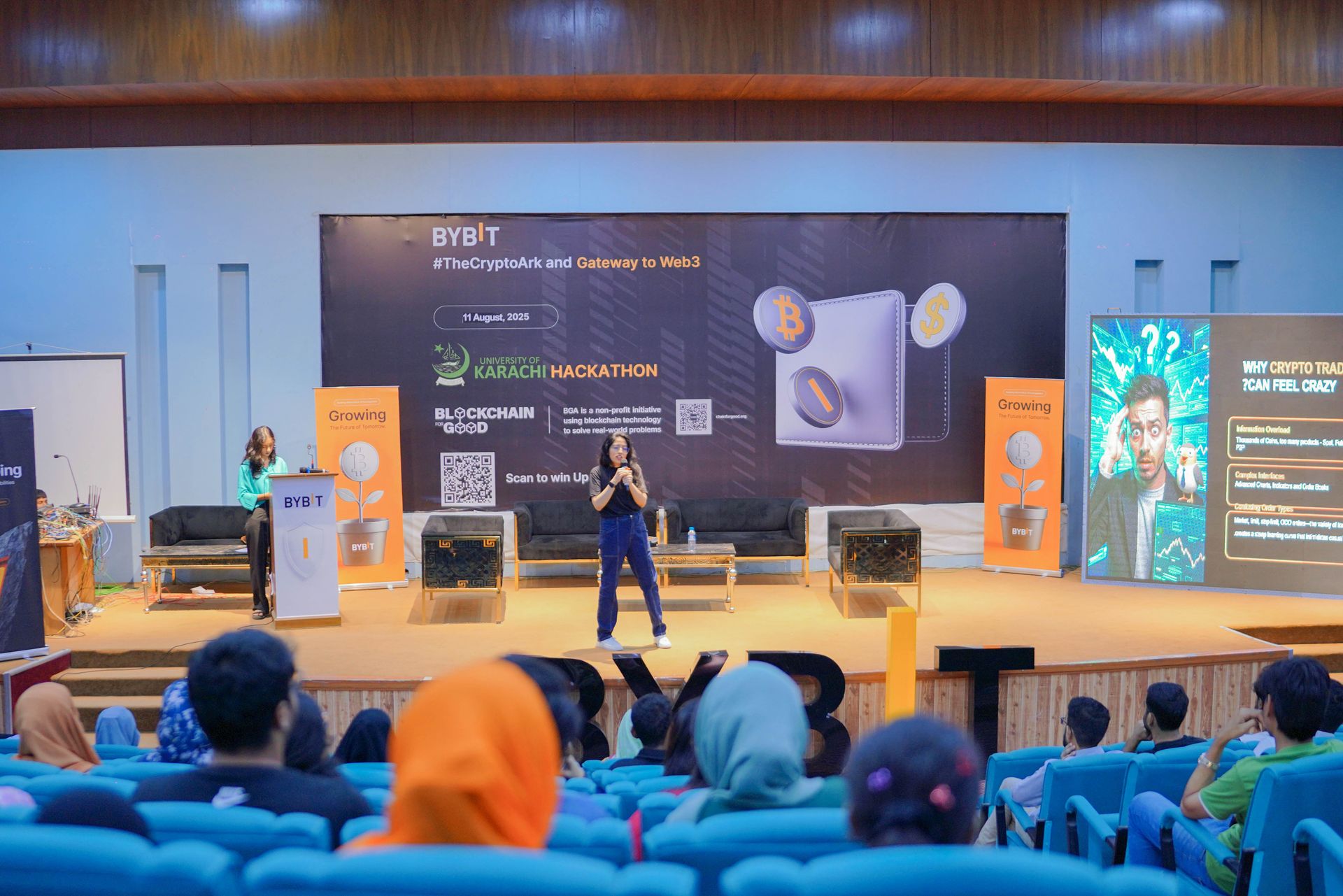 CoinConnect and Bybit co-branded backdrop at the Pakistan market activation event in Karachi, May 2025 — five attendees holding Bybit Instagram-frame prop in front of the alternating CoinConnect and Bybit logo step-and-repeat